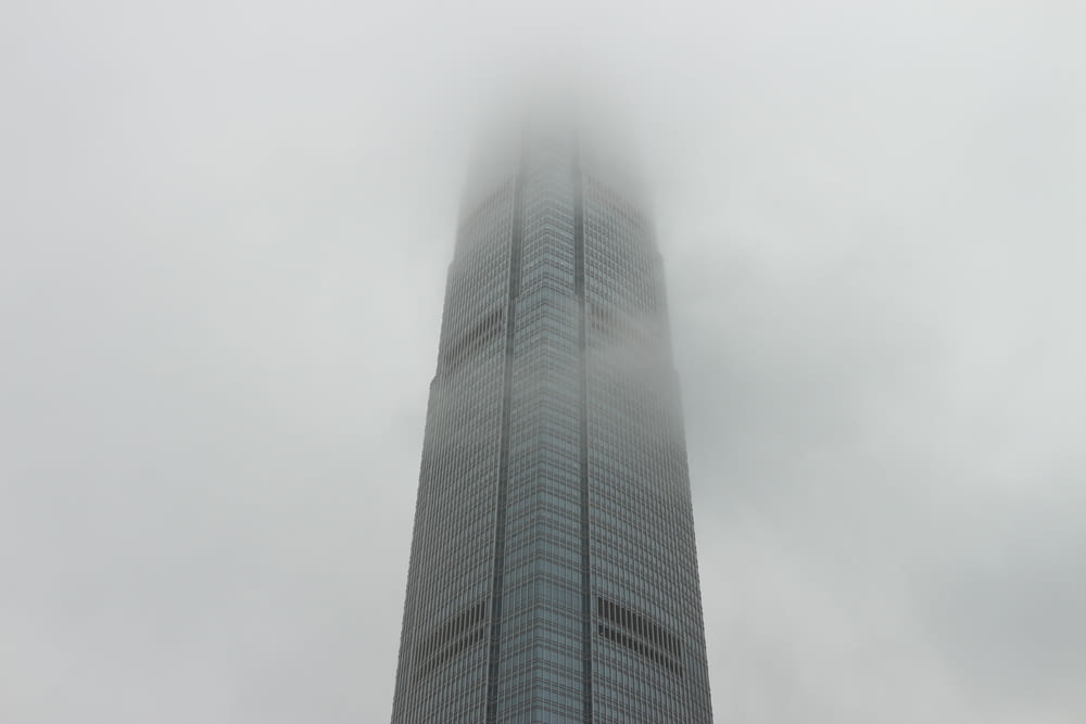 a very tall building with a very foggy sky behind it