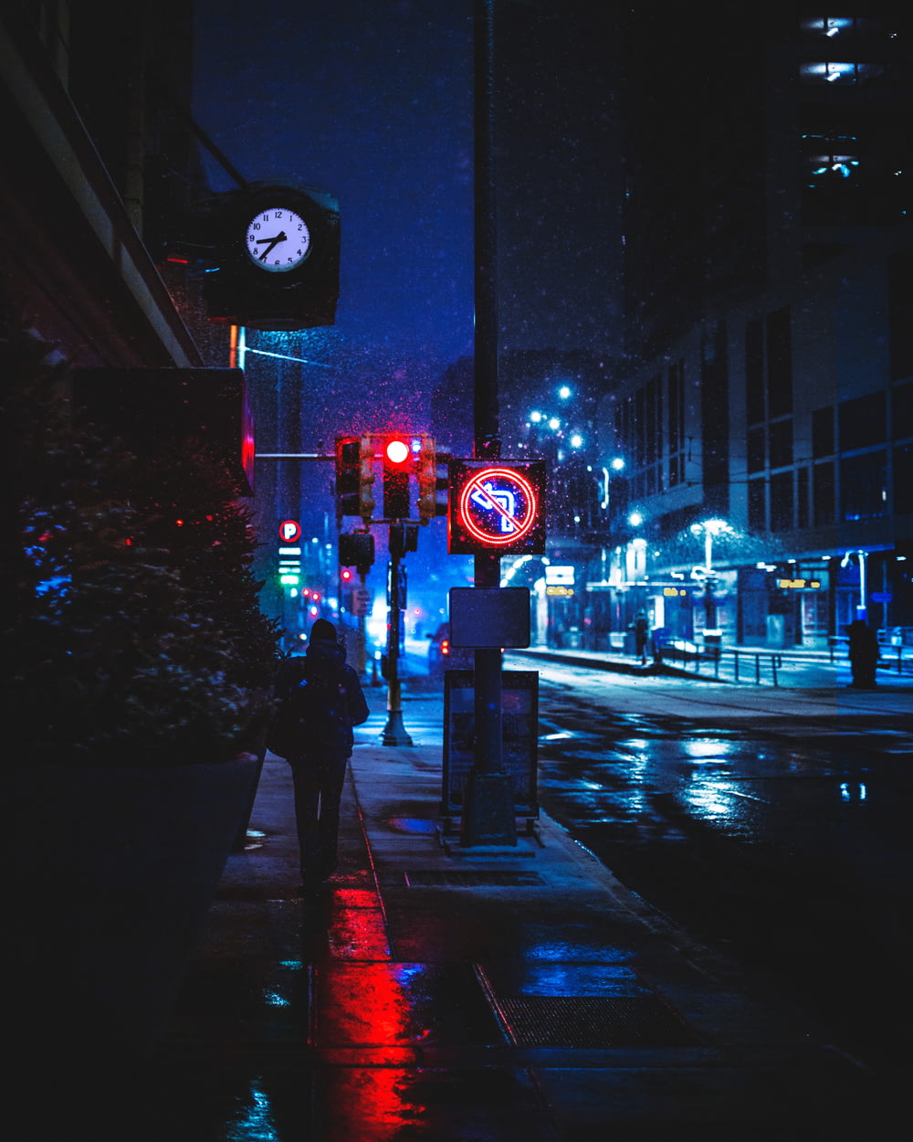 red and white traffic light on the street during night time