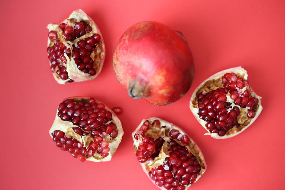 red fruit on pink surface