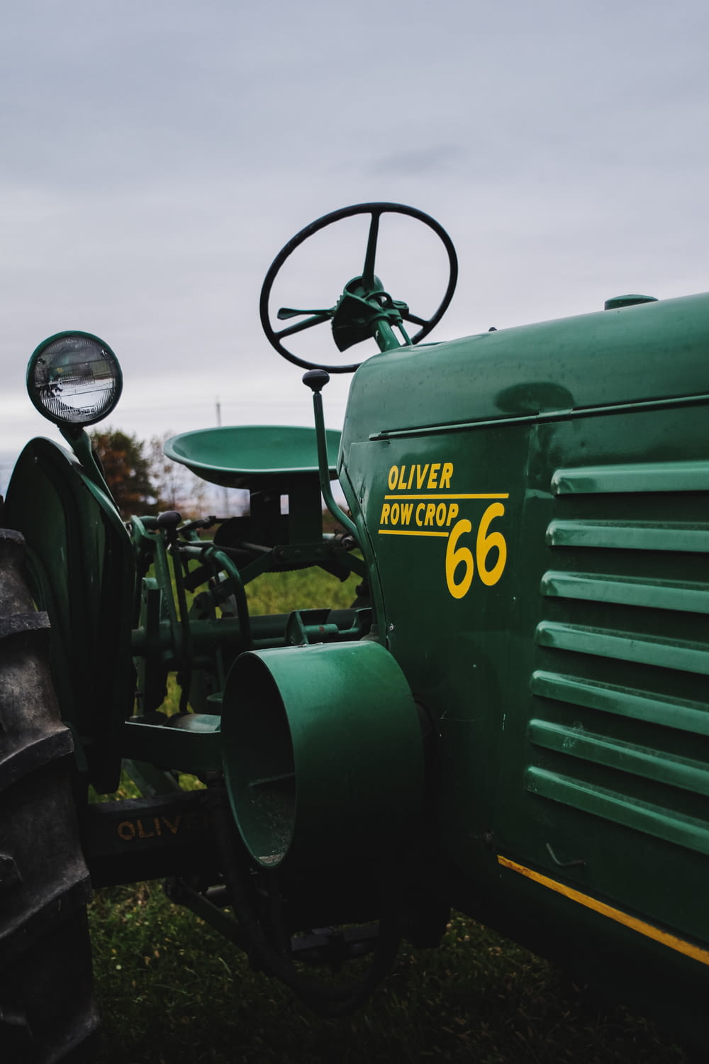 a close up of the front of a green tractor