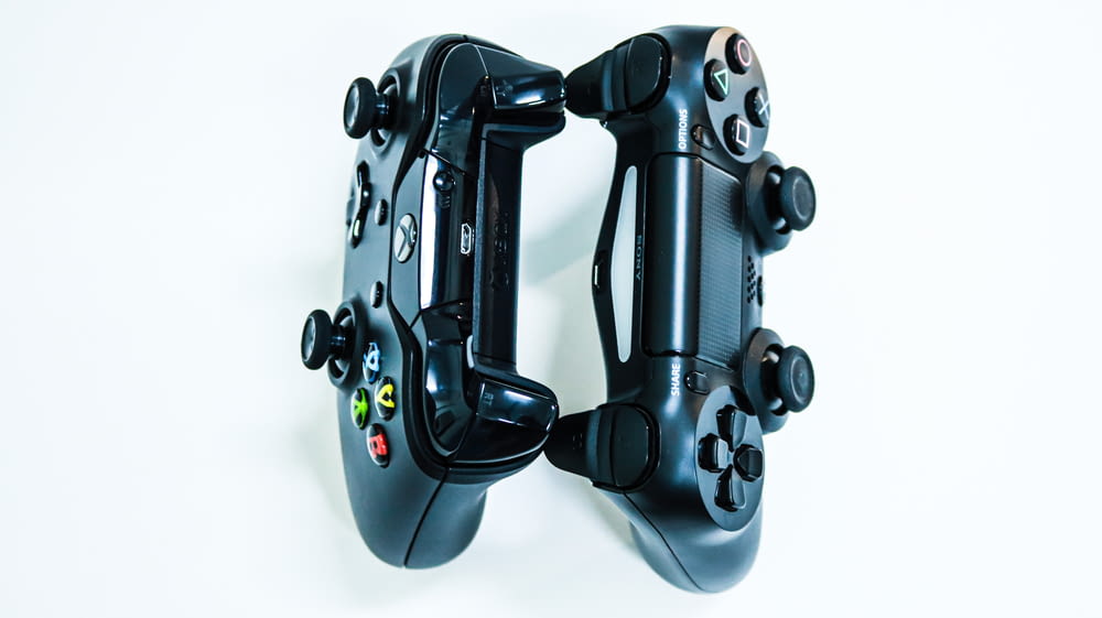 a close up of two video game controllers