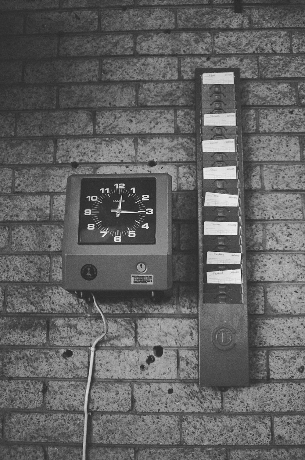 black and white analog wall clock at 10 00