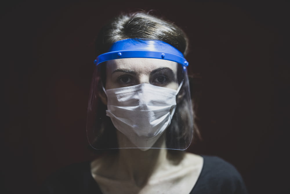 woman in white face mask