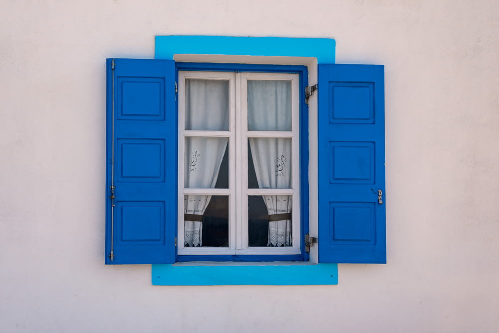 blue wooden framed glass window