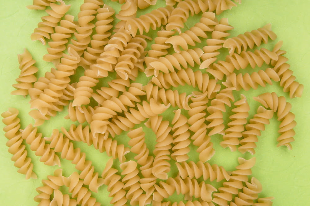 yellow pasta on green plate