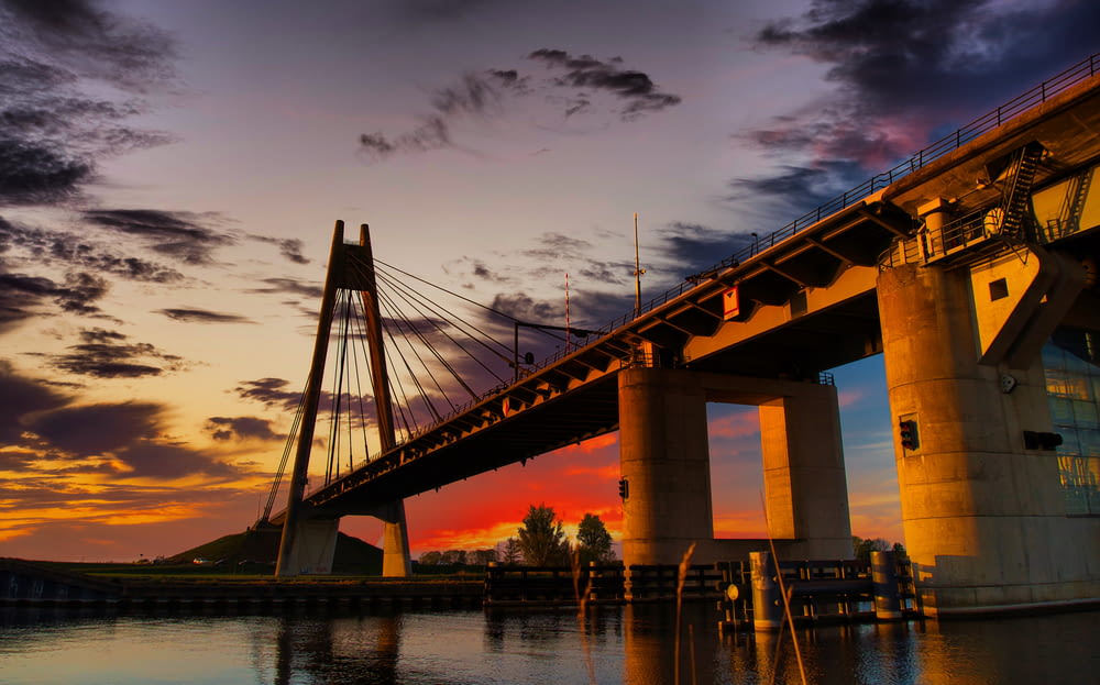 bridge over water during sunset