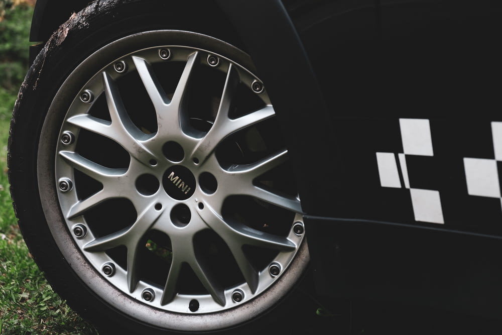 silver 5 spoke wheel with tire
