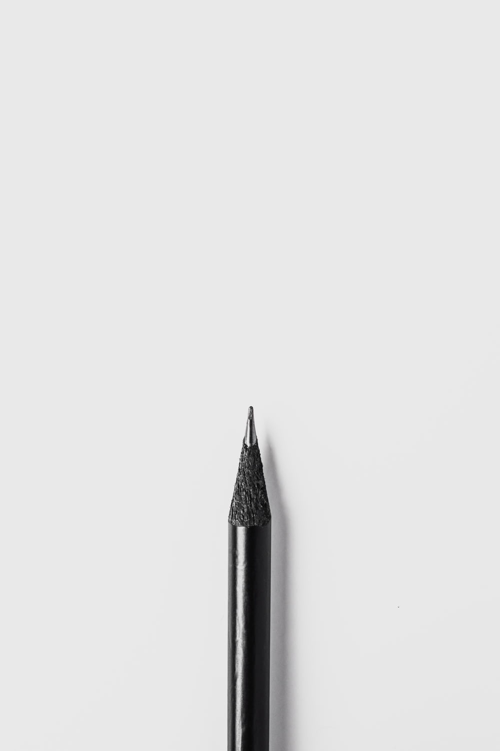 black pencil on white surface
