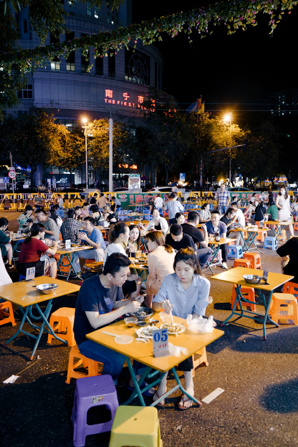 people sitting on chair in front of table during night time