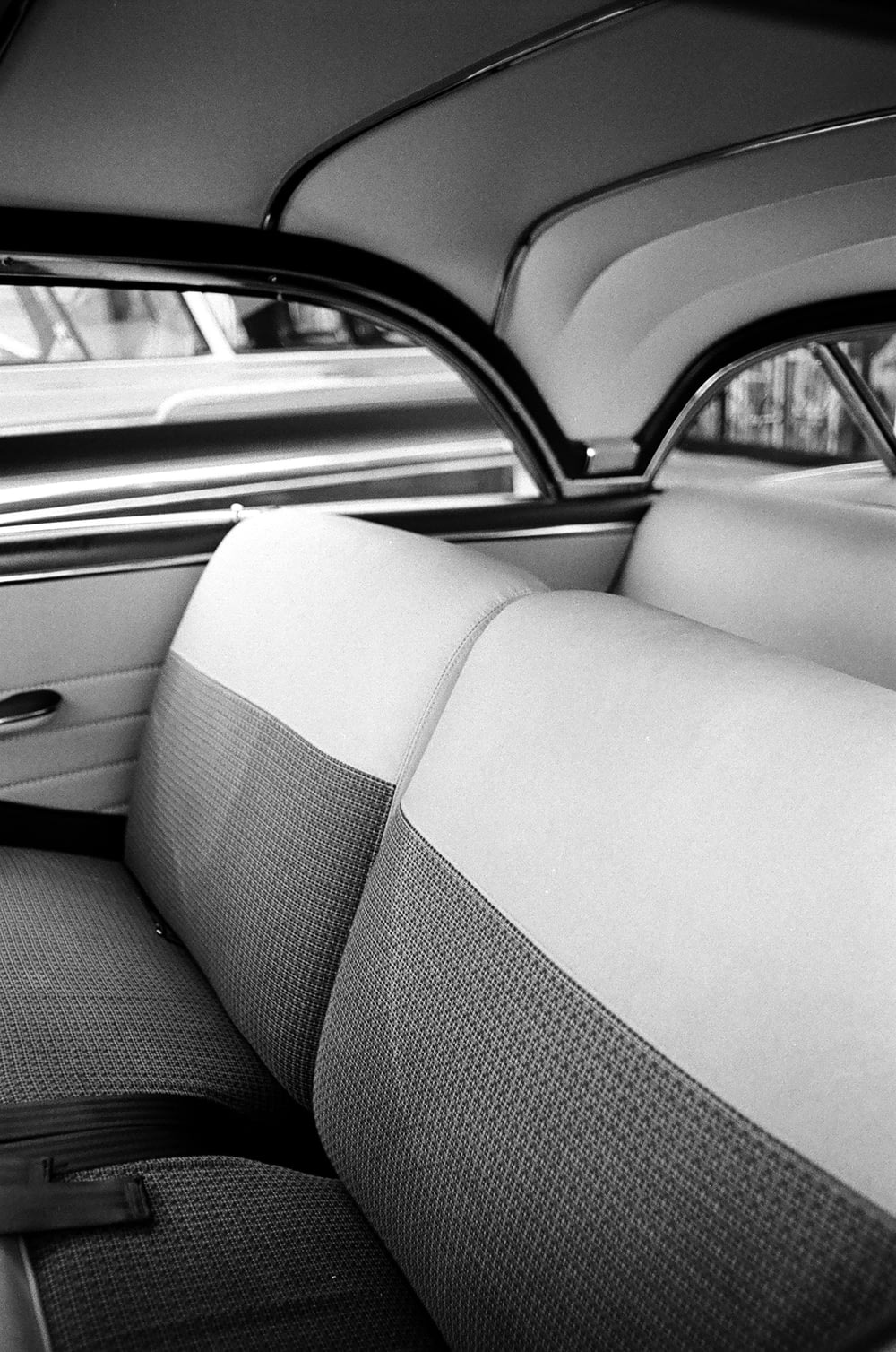 gray car seat in grayscale