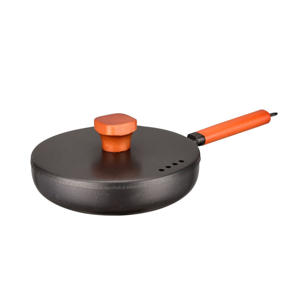 black and orange round portable speaker