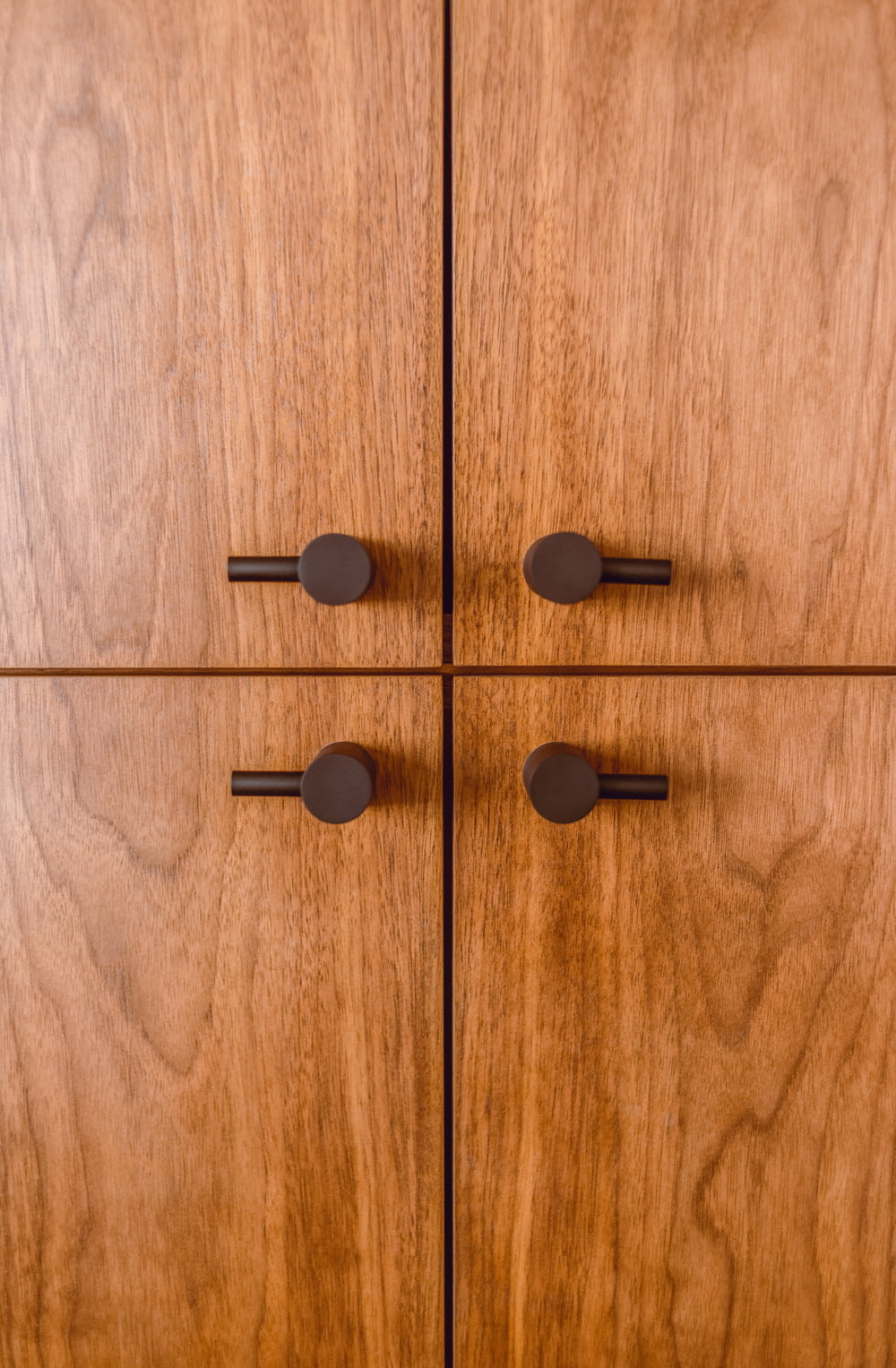 black round buttons on brown wooden surface