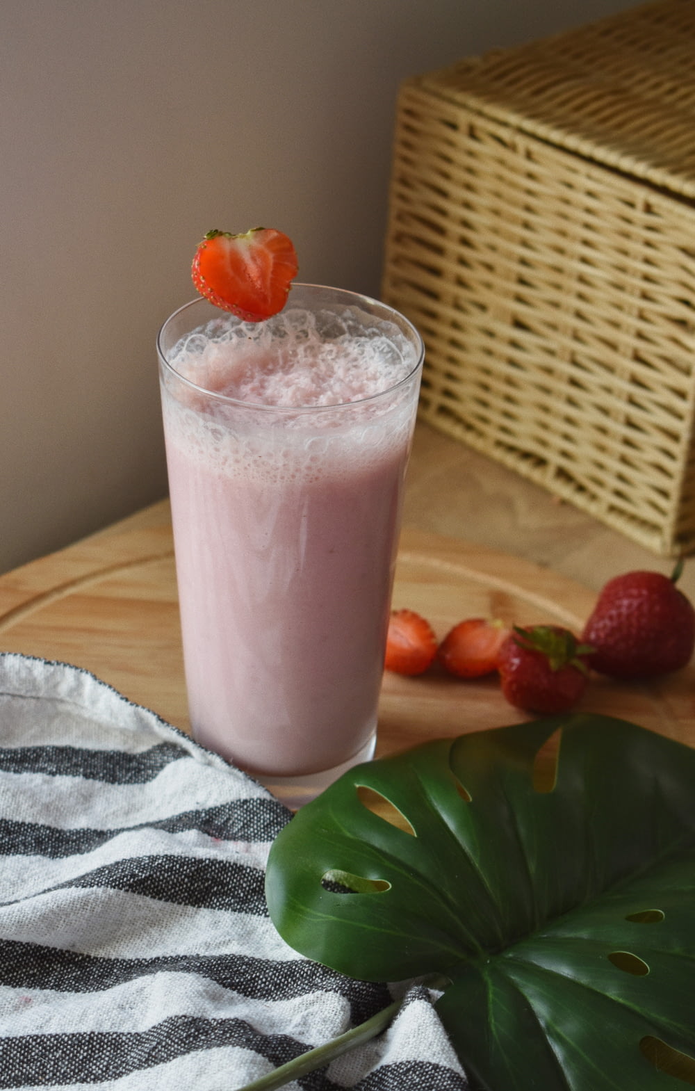 strawberry shake on clear drinking glass
