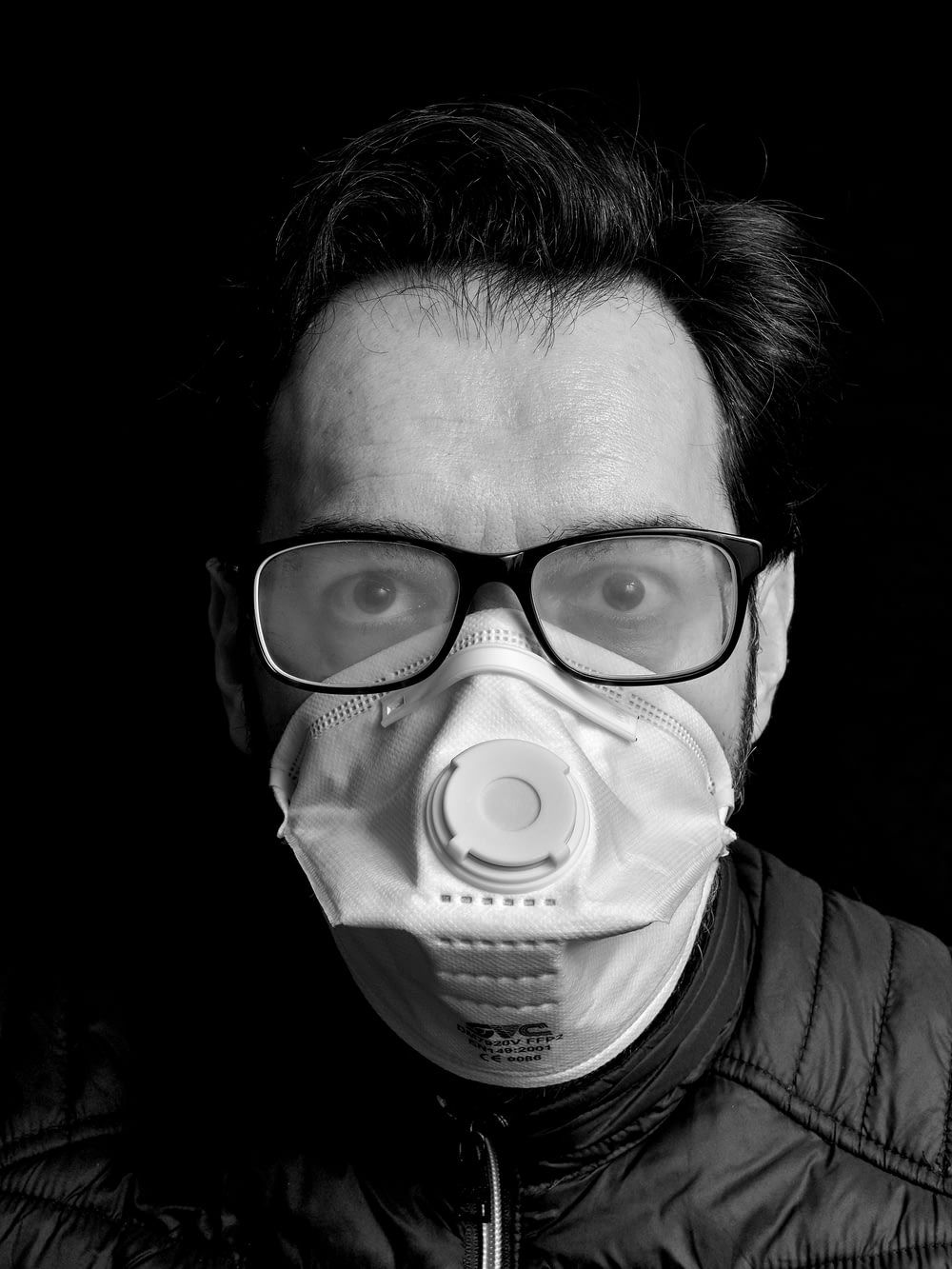 grayscale photo of person wearing eye mask