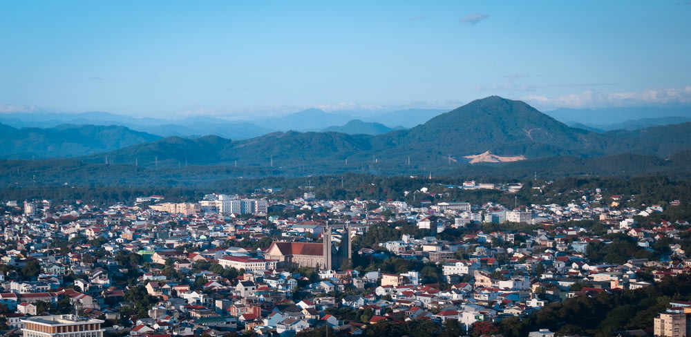 aerial view of city near mountain during daytime