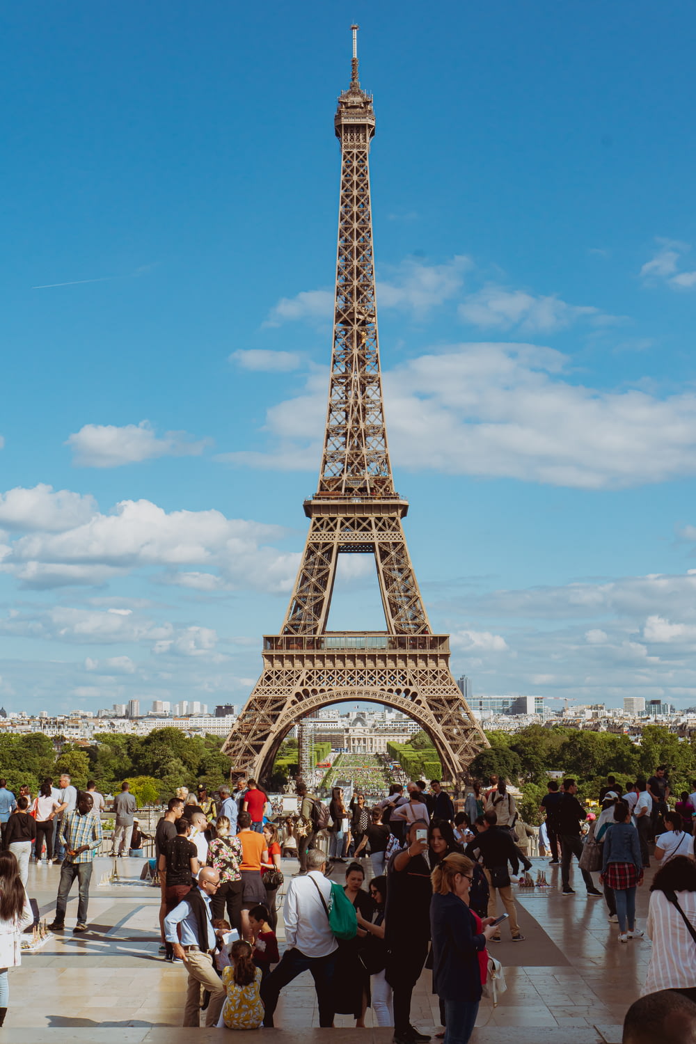 people standing near eiffel tower during daytime