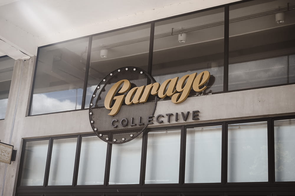 a garage collective sign on the side of a building