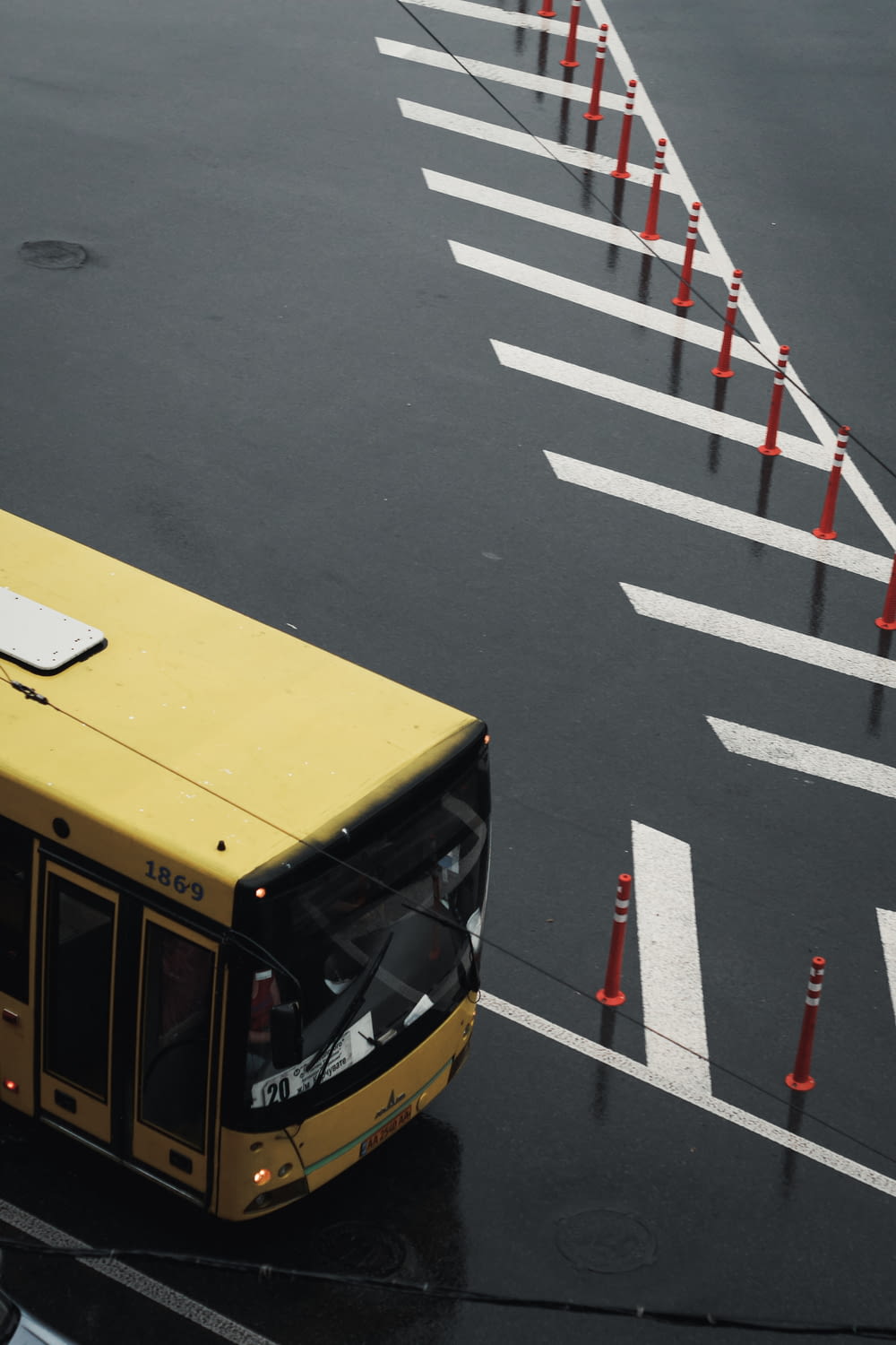 yellow bus on gray asphalt road during daytime