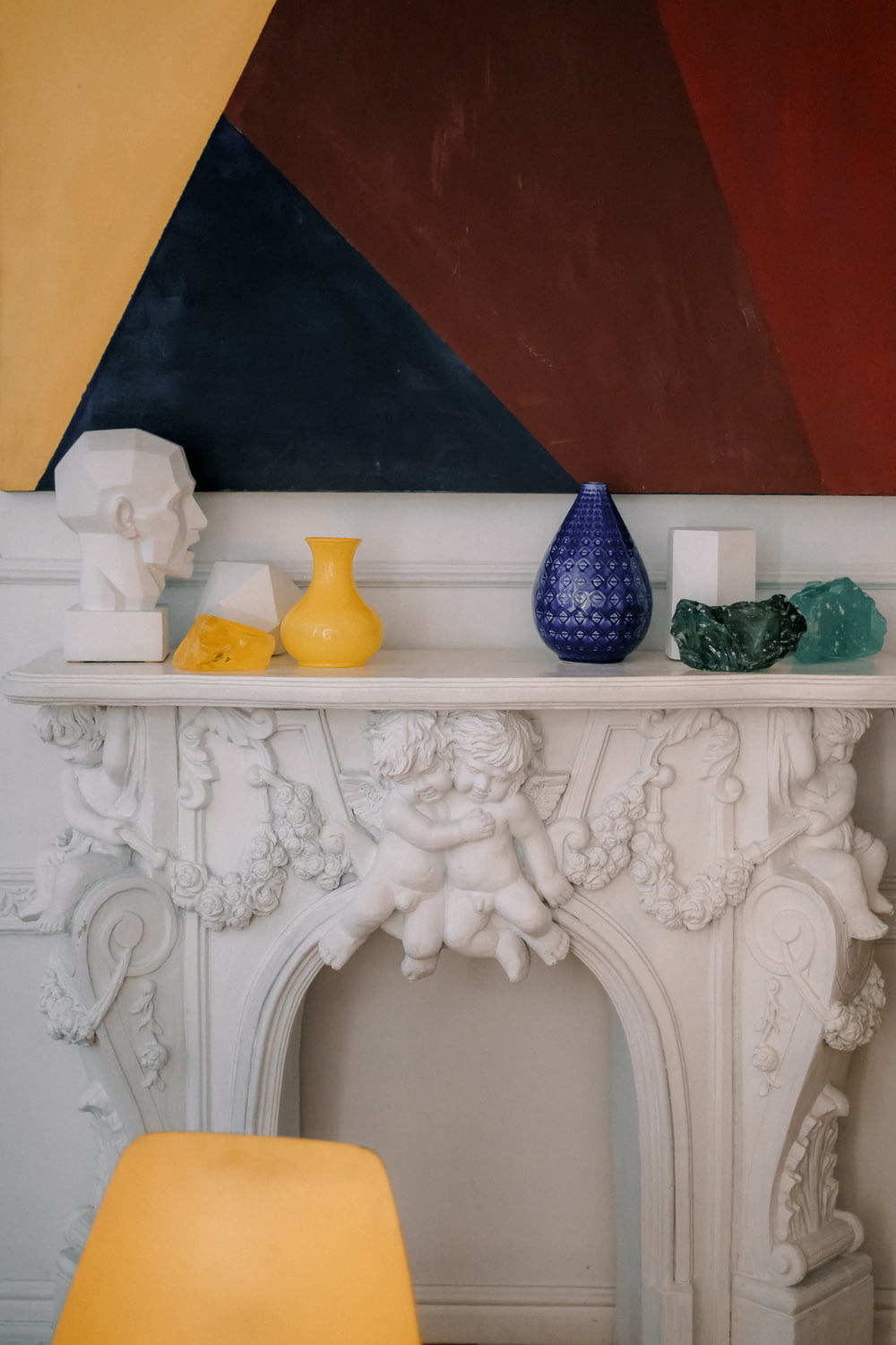 blue ceramic vase on white wooden table