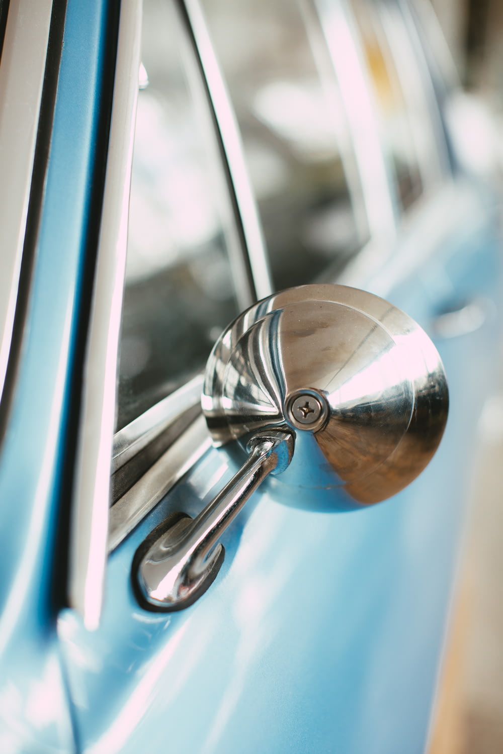 silver door knob in blue car