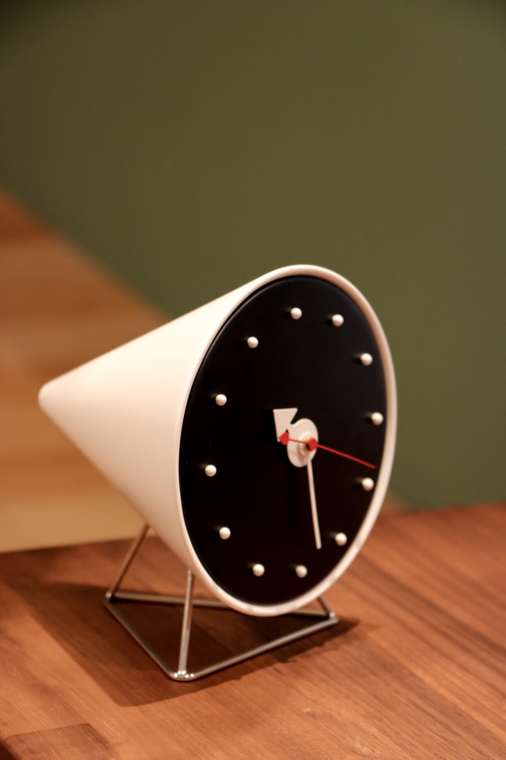 white and black round analog wall clock