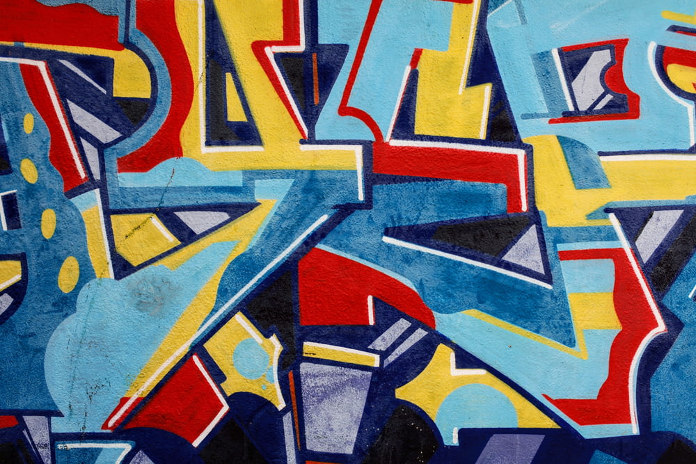 a painting of blue, yellow, and red letters