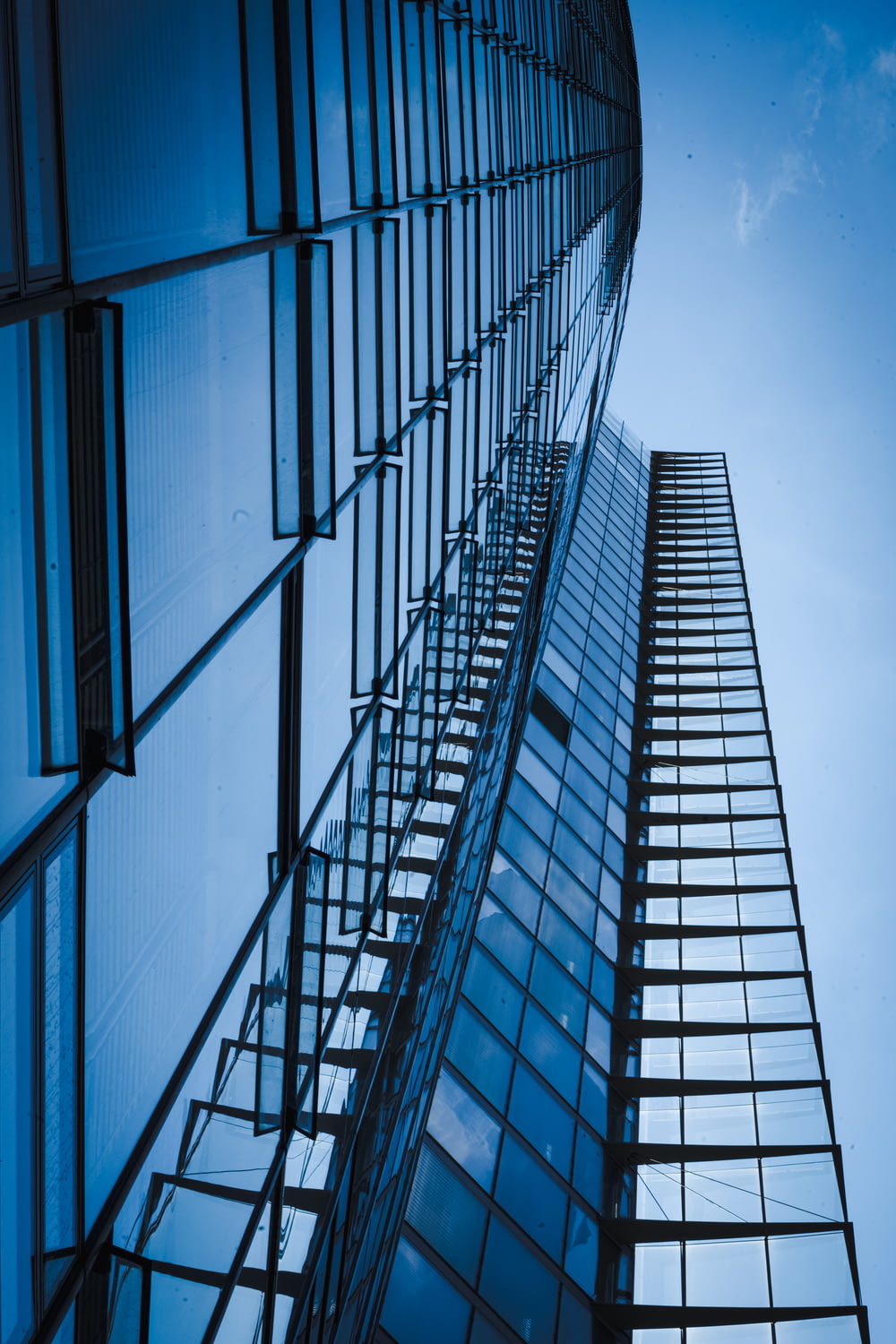 low angle photography of glass walled building