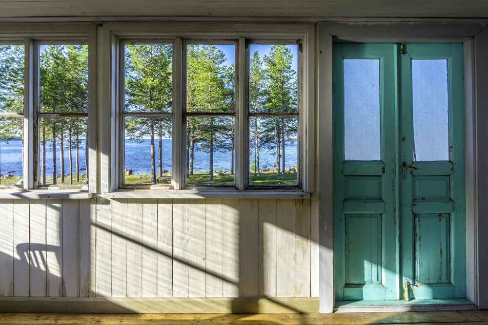 green wooden window frame during daytime