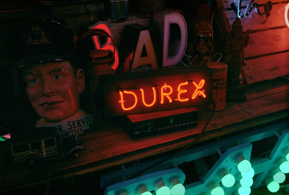 a neon sign that says durex on it