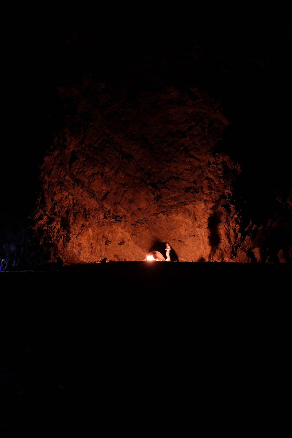 people in cave during night time