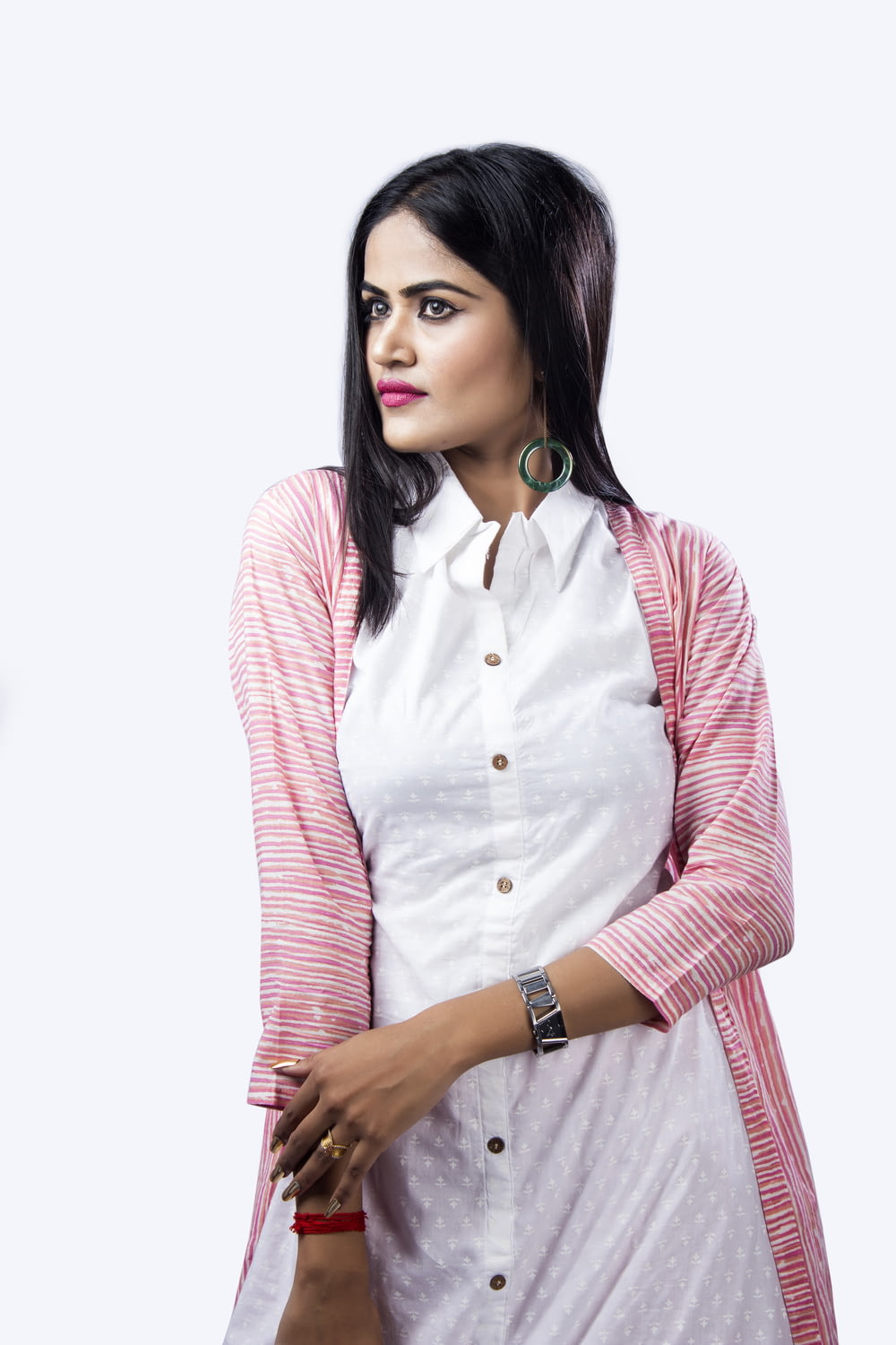 woman in pink and white striped cardigan
