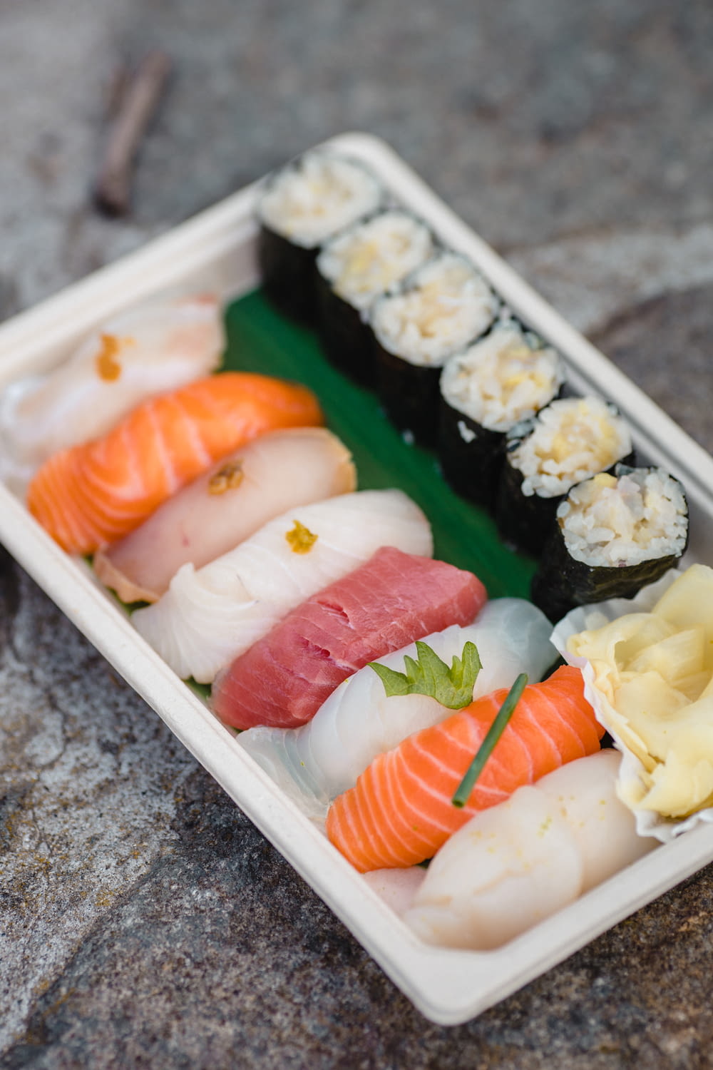sushi on white plastic container