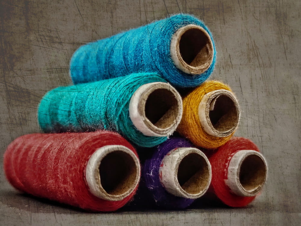 blue red and yellow thread rolls