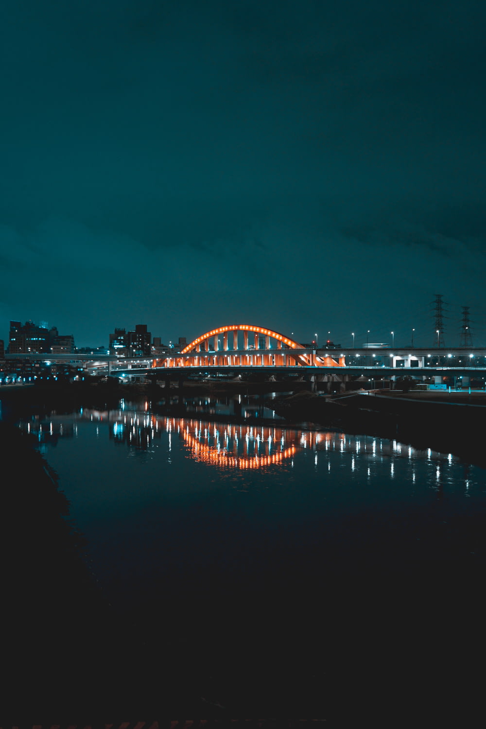 bridge over water during night time