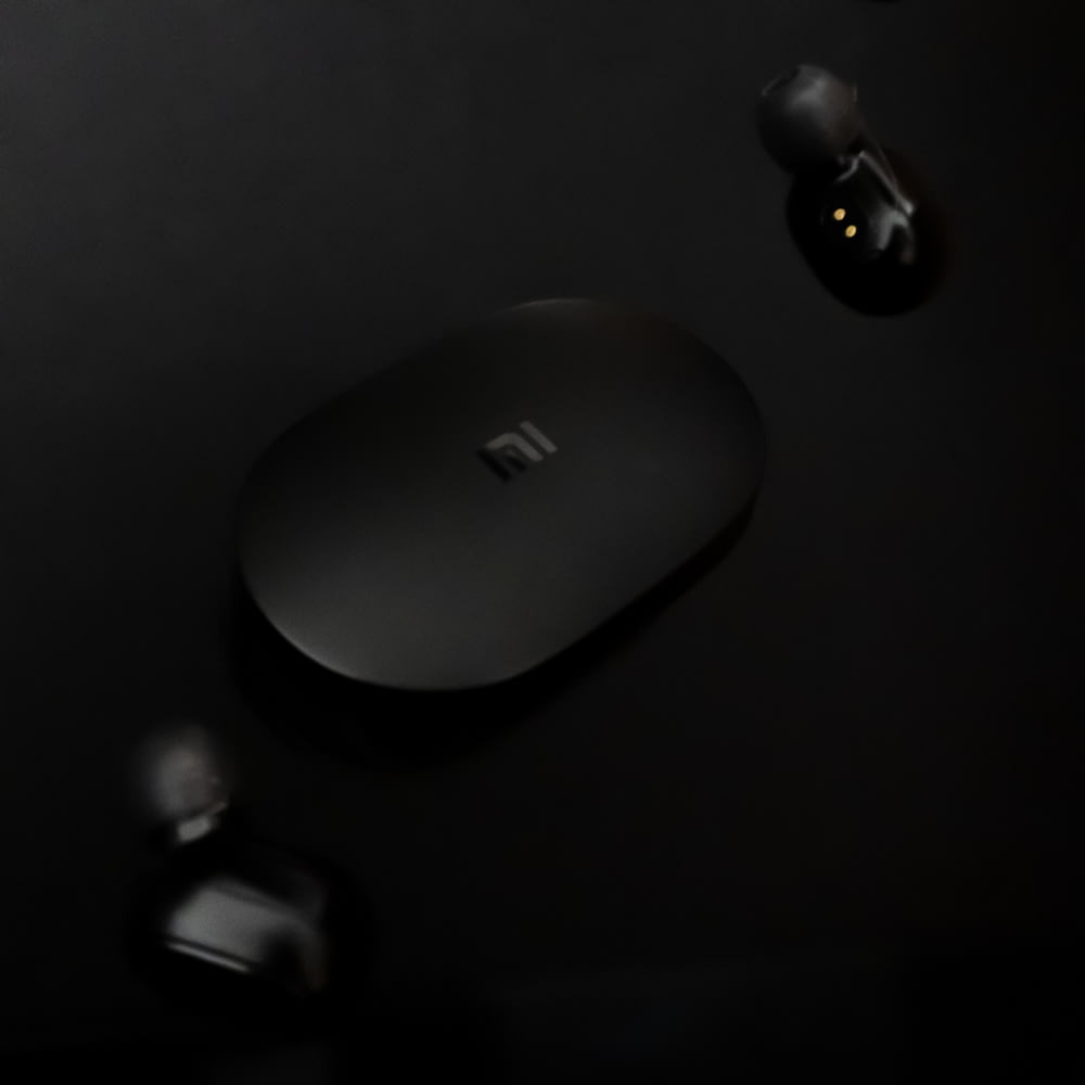 apple magic mouse on black surface