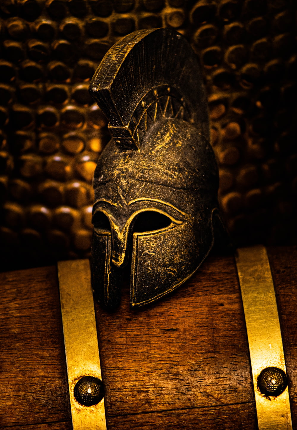 black leather mask on brown wooden table