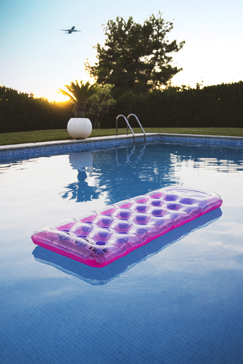 pink inflatable ring on swimming pool