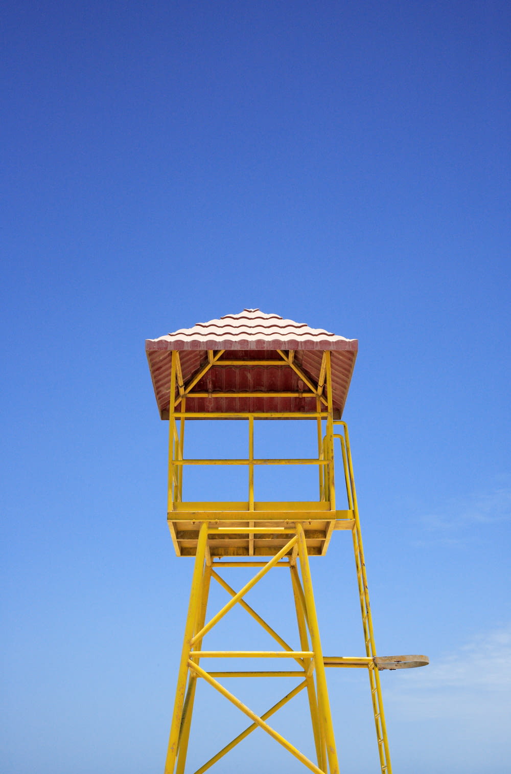 brown wooden tower under blue sky during daytime