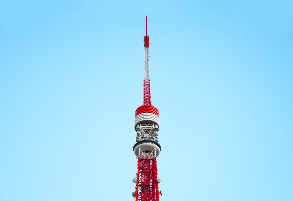 red and white tower under blue sky