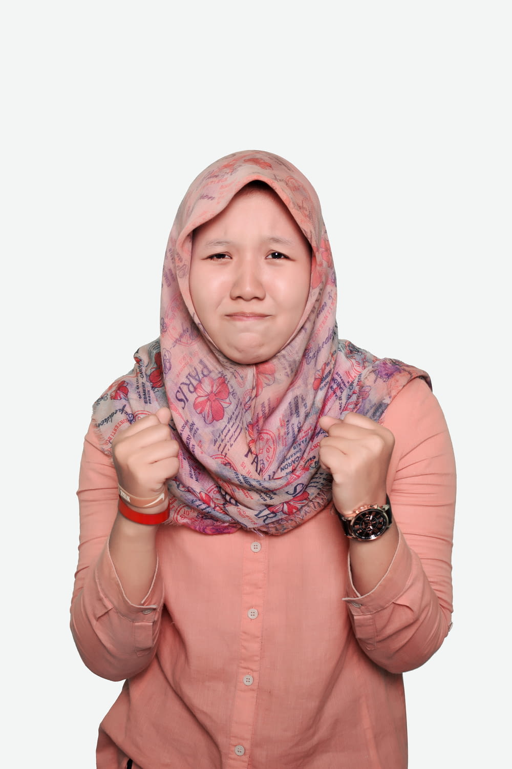 woman in pink hijab and pink button up long sleeve shirt