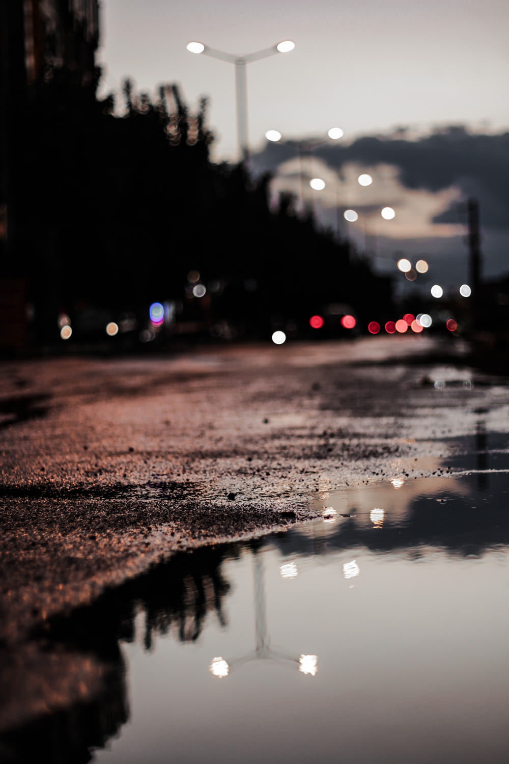 water droplets on wet ground during night time