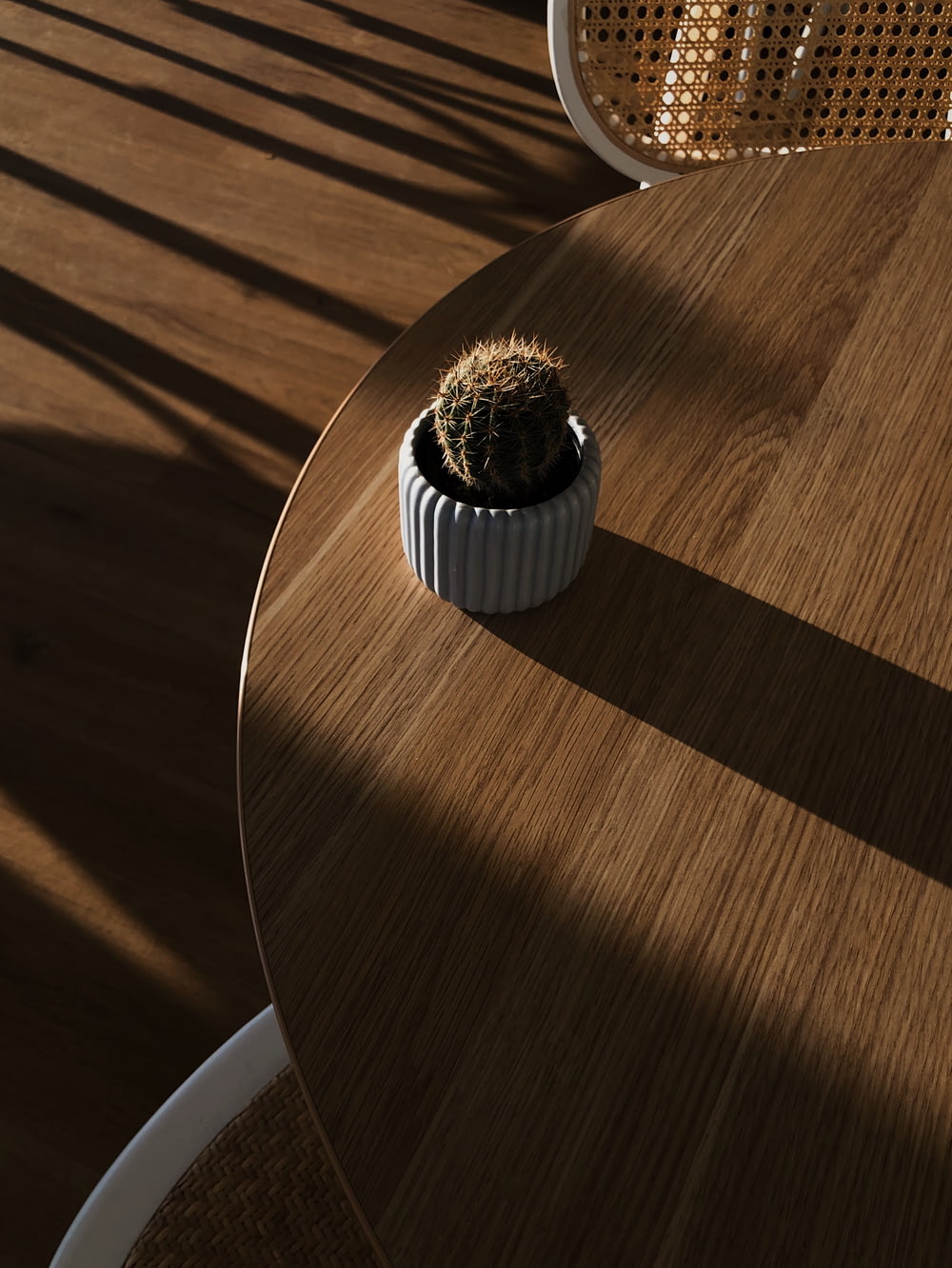 white and black round ornament on brown wooden table