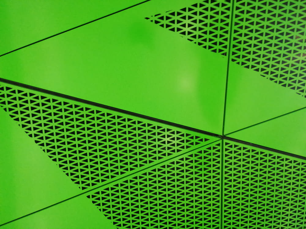 green metal frame on green wall