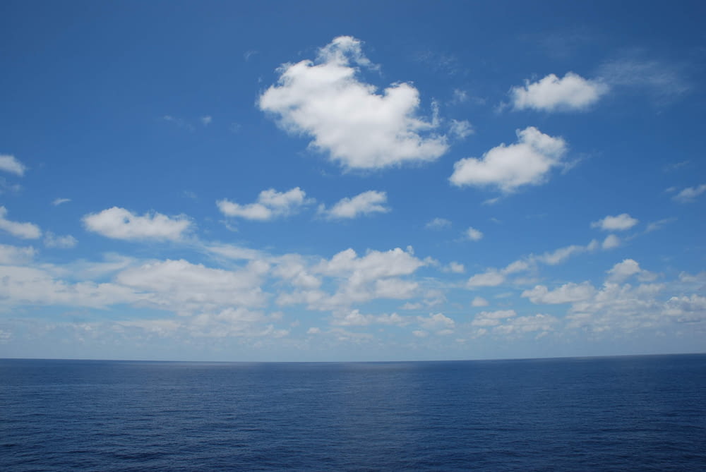 blue sky and white clouds over sea