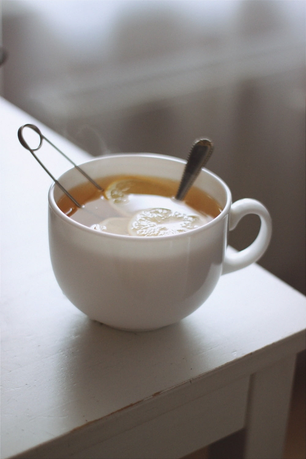 white ceramic mug with coffee