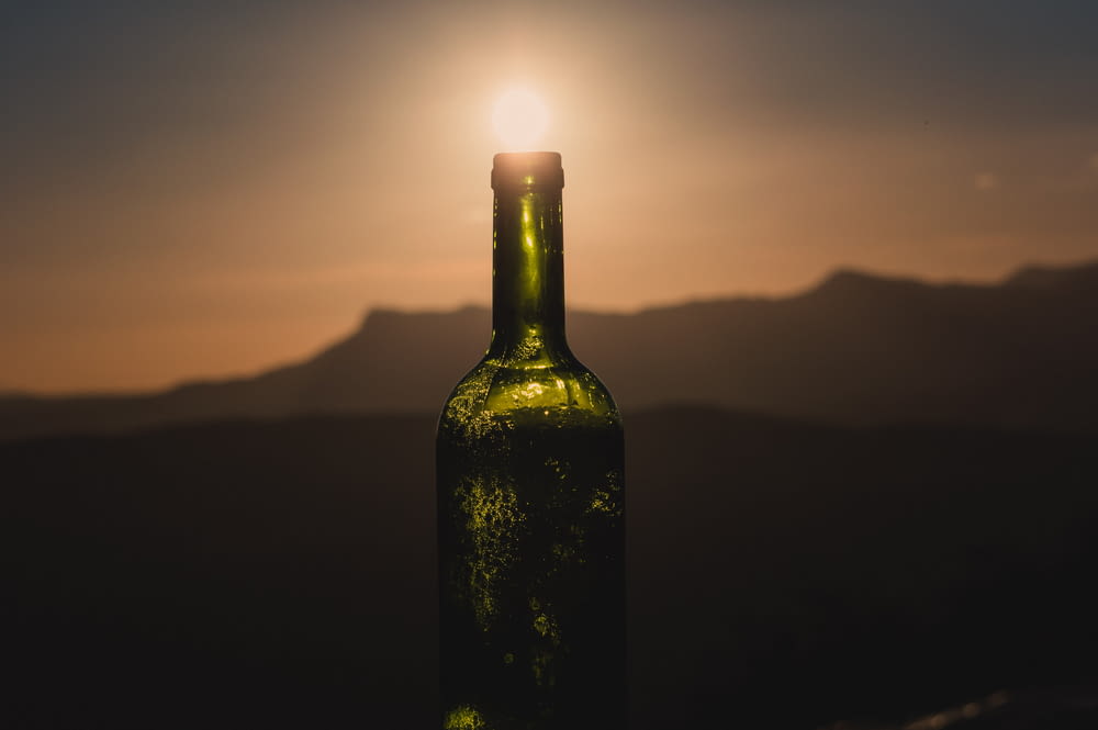 silhouette of bottle during sunset