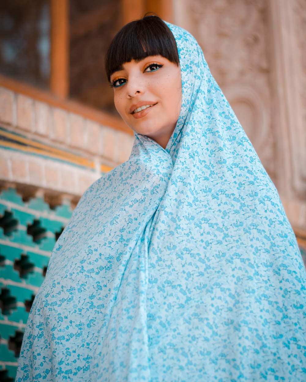 woman in blue hijab standing