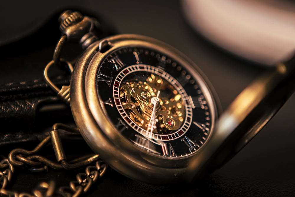 gold and silver round chronograph watch