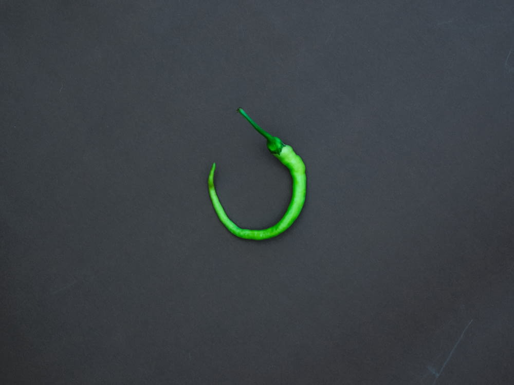 green rubber band on black textile