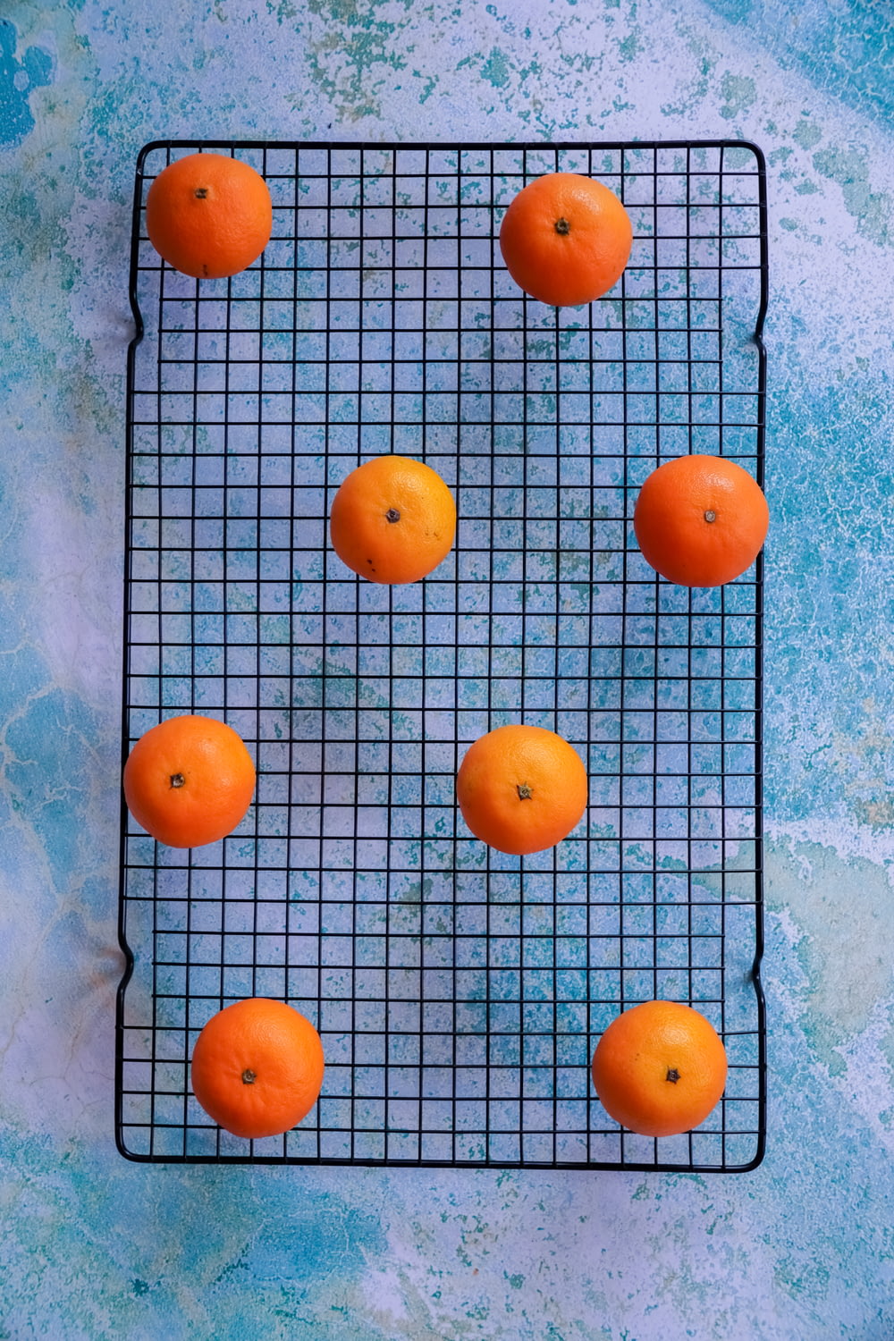 orange fruits on blue table